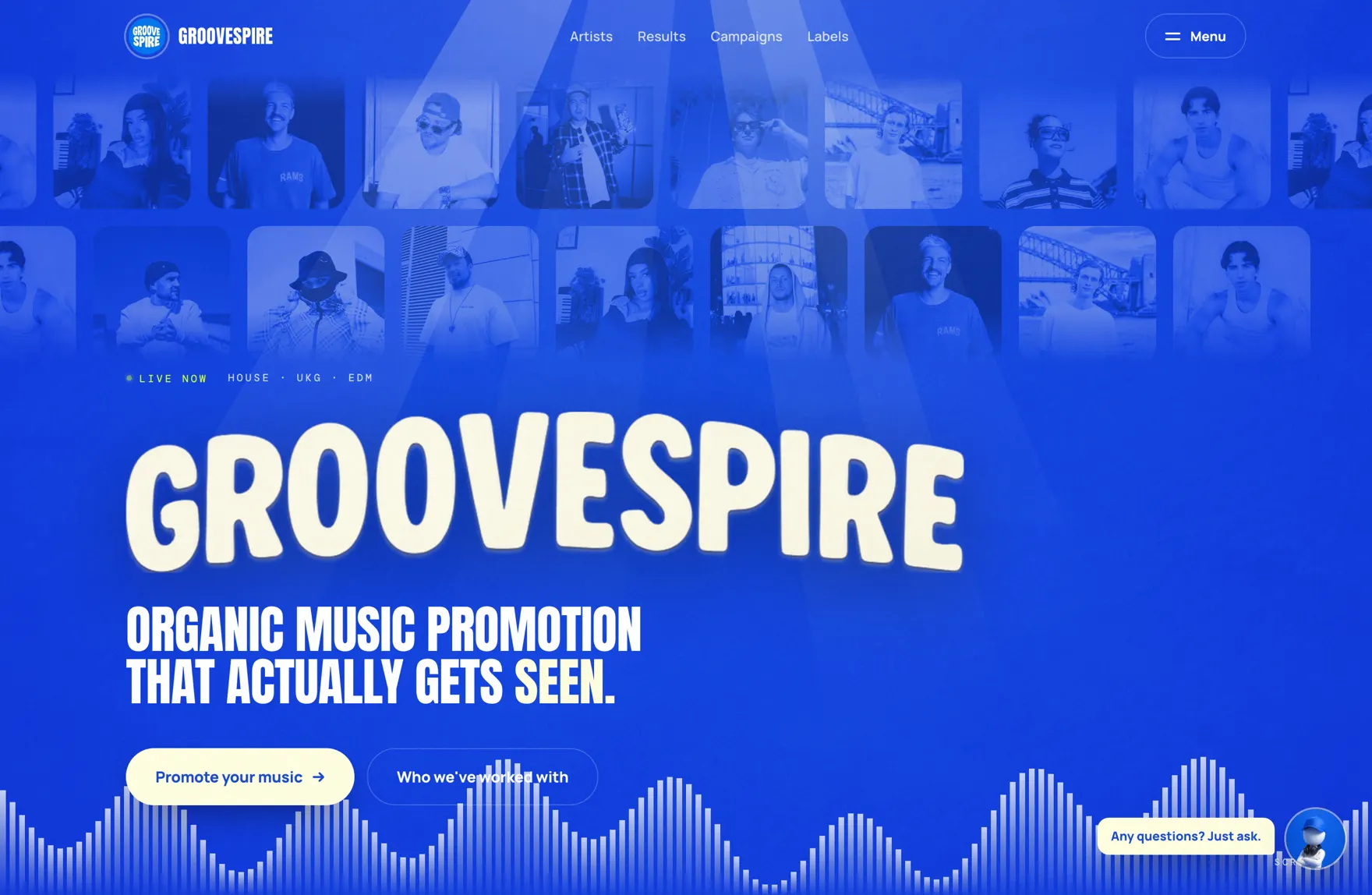 The GrooveSpire homepage: royal blue, a wall of artist photos and the headline organic music promotion that actually gets seen.